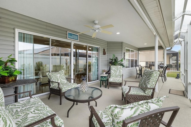 sunroom featuring ceiling fan