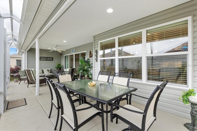 view of patio / terrace with outdoor dining area and a ceiling fan