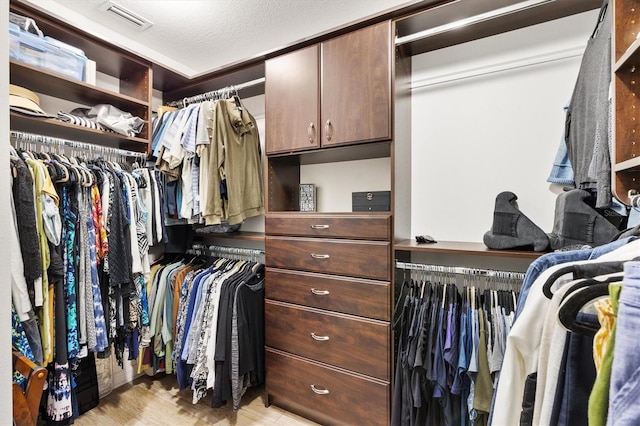 walk in closet featuring visible vents