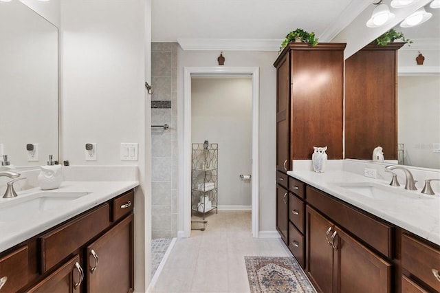 full bathroom with crown molding, two vanities, a walk in shower, and a sink