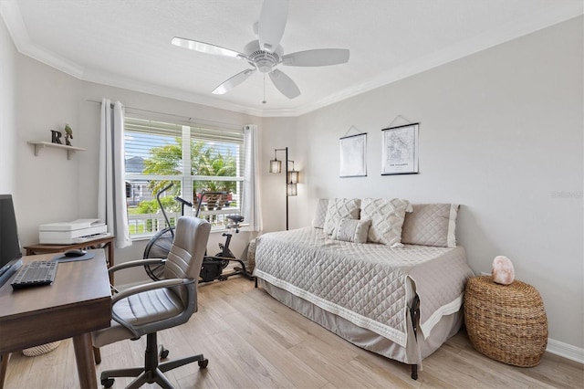 bedroom with baseboards, light wood-style flooring, a ceiling fan, and crown molding