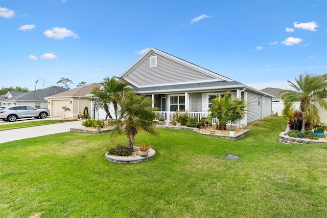 view of front of property featuring a garage, concrete driveway, a porch, and a front lawn