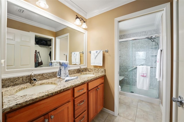 bathroom with a sink, double vanity, and a shower stall