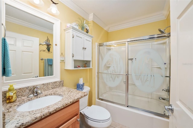 full bathroom featuring combined bath / shower with glass door, toilet, vanity, and crown molding