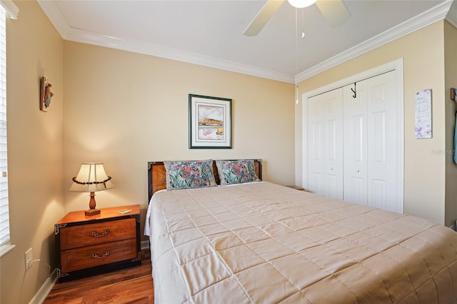 bedroom featuring a closet, wood finished floors, and ornamental molding