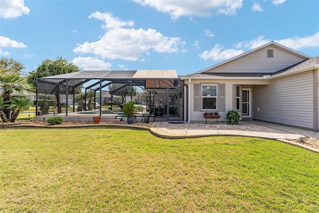 back of house with an outdoor pool, a yard, a patio, and glass enclosure