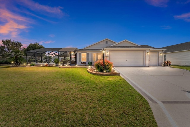 ranch-style house featuring a garage, driveway, and a front yard