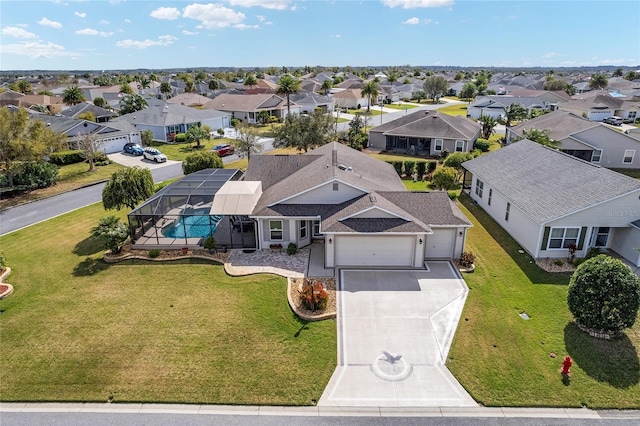 birds eye view of property with a residential view