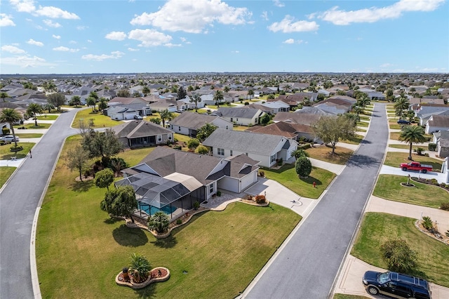 birds eye view of property with a residential view