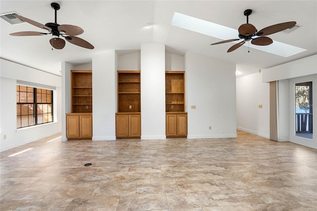 unfurnished living room with ceiling fan, lofted ceiling with skylight, and visible vents