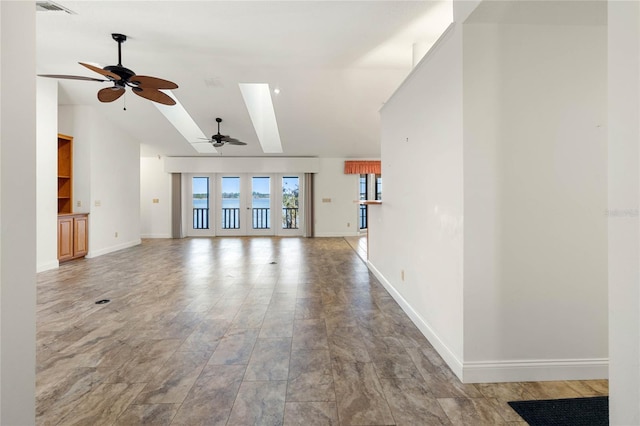 unfurnished living room with high vaulted ceiling, a ceiling fan, visible vents, baseboards, and french doors