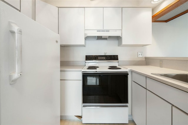 kitchen featuring light countertops, electric range, white cabinetry, and under cabinet range hood