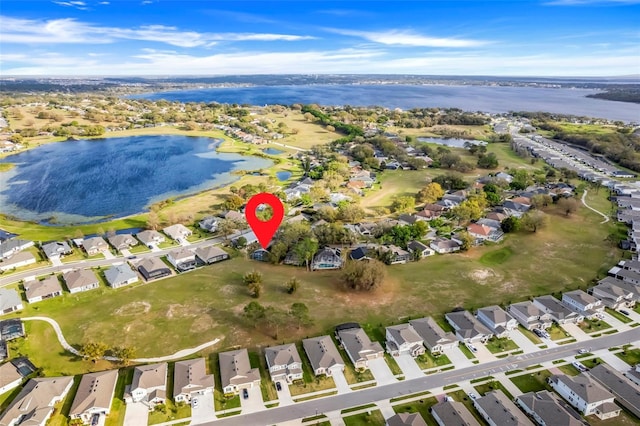 aerial view with a residential view and a water view