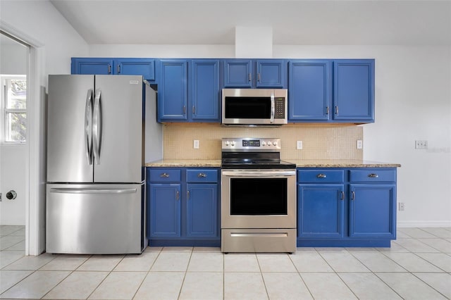 kitchen featuring appliances with stainless steel finishes and blue cabinetry