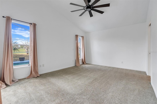 empty room featuring ceiling fan, high vaulted ceiling, carpet flooring, and baseboards