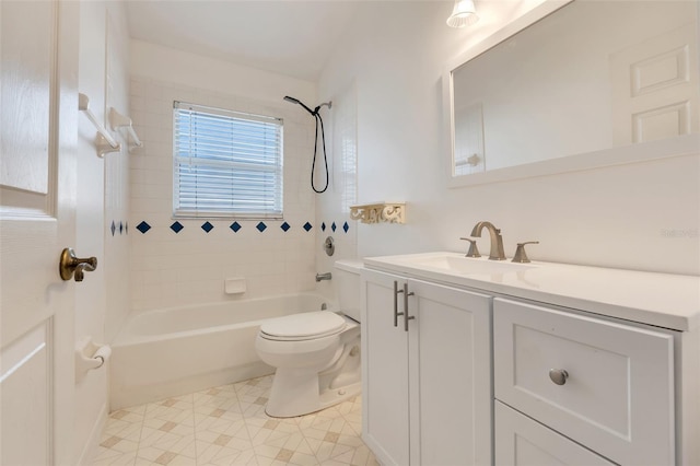 bathroom featuring toilet, bathtub / shower combination, and vanity