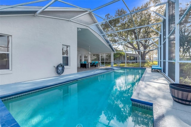 pool featuring a lanai and a patio area