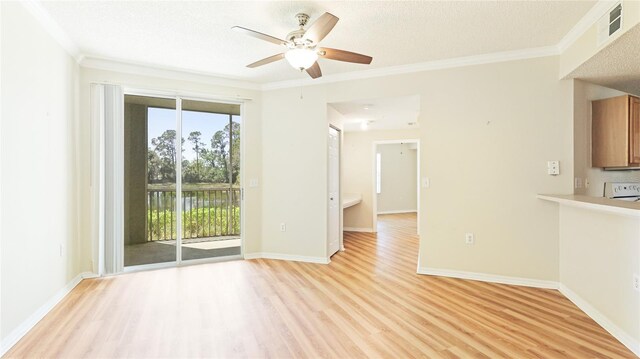 unfurnished living room with crown molding, light wood-style flooring, and plenty of natural light