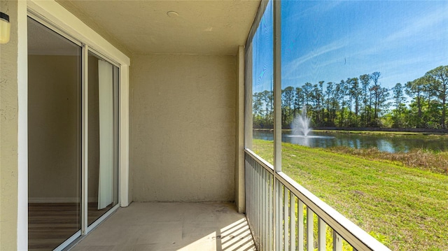 balcony featuring a water view