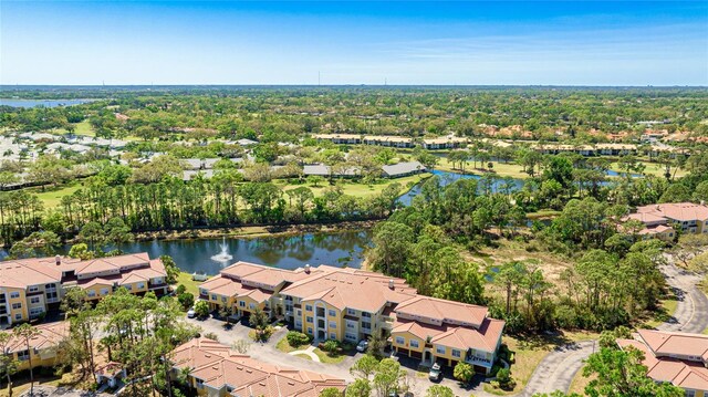 drone / aerial view featuring a residential view and a water view