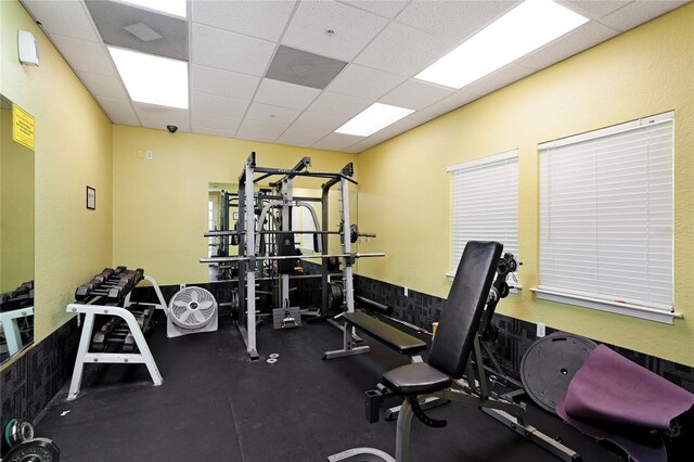 workout area with a drop ceiling