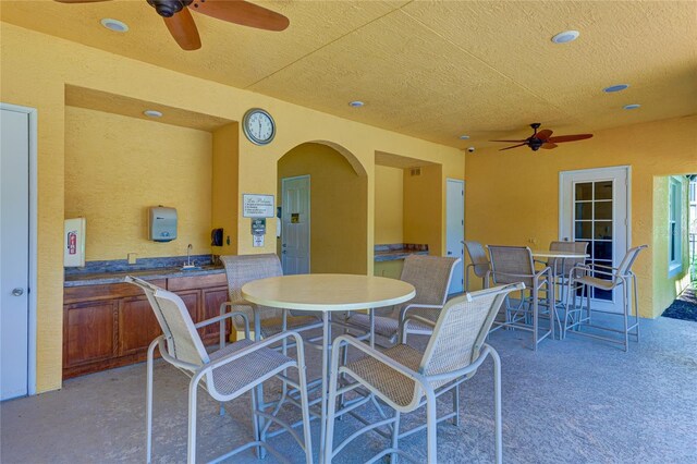 view of patio / terrace with outdoor dining area and ceiling fan