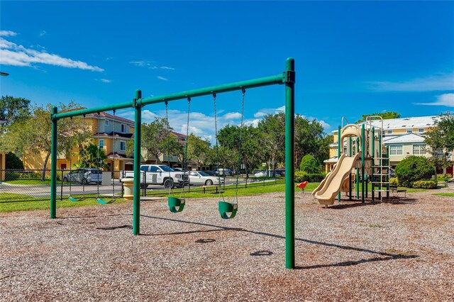 community jungle gym featuring fence