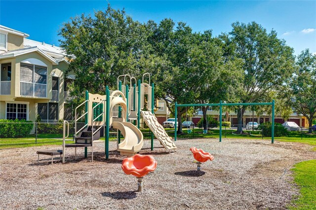 communal playground featuring fence