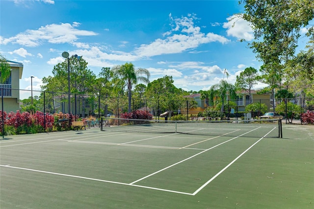 view of sport court with fence