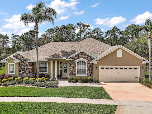 ranch-style house featuring a front yard, concrete driveway, an attached garage, and stucco siding