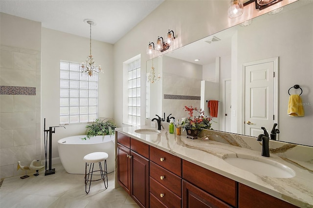 full bath with a freestanding bath, double vanity, a walk in shower, and a sink