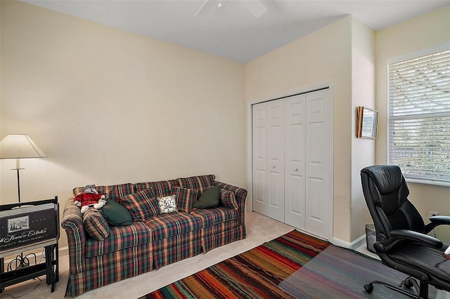 carpeted home office featuring baseboards