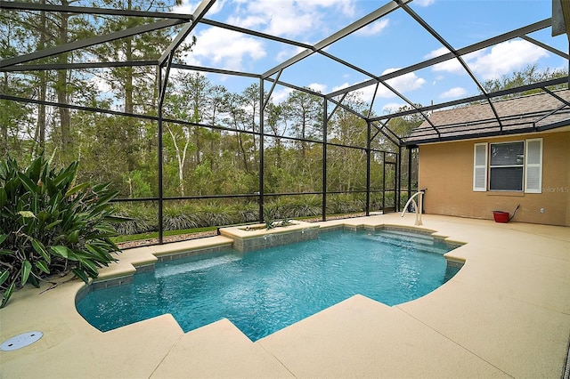 outdoor pool with a patio area and glass enclosure