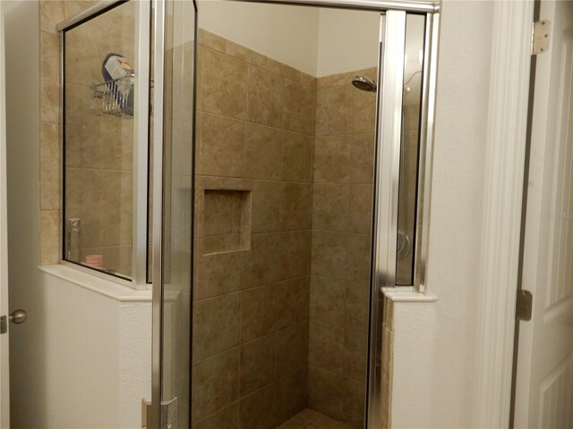 bathroom with a stall shower