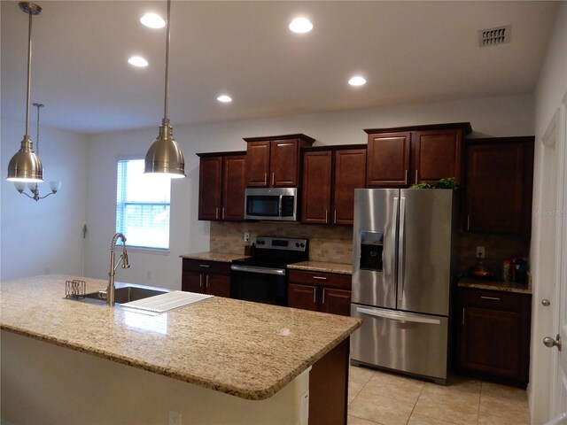 kitchen featuring visible vents, recessed lighting, appliances with stainless steel finishes, decorative light fixtures, and tasteful backsplash