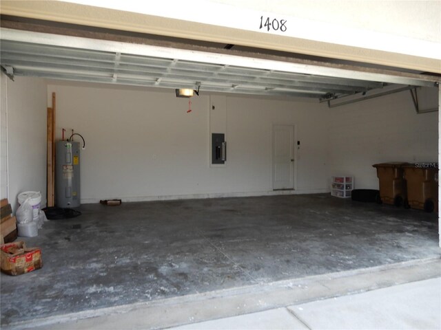 garage with electric panel, a garage door opener, and electric water heater