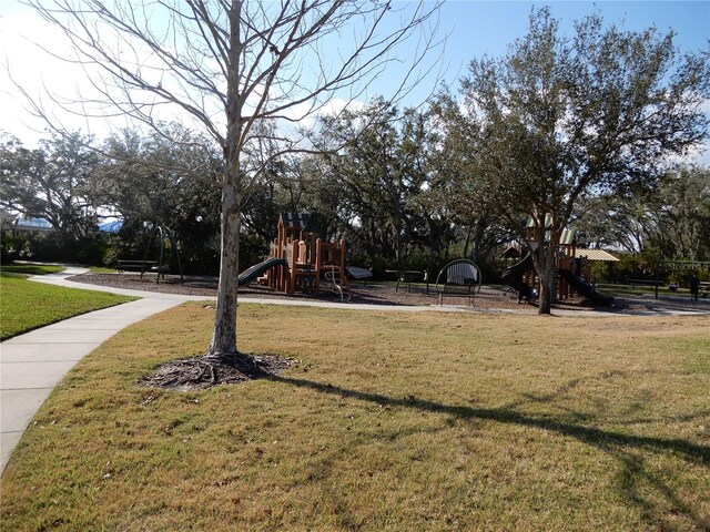 communal playground featuring a yard