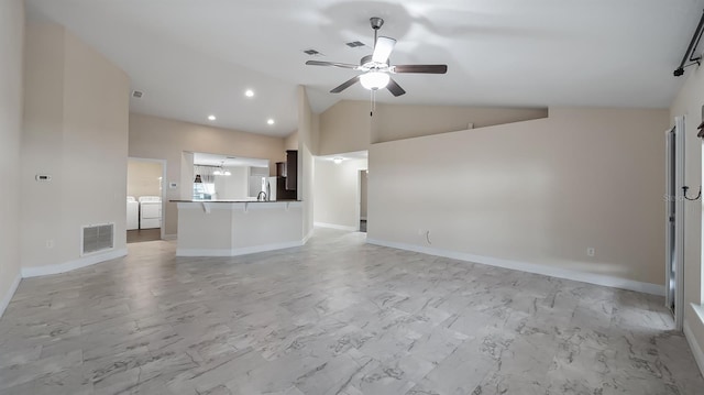 unfurnished living room featuring marble finish floor, washer and clothes dryer, visible vents, and a ceiling fan