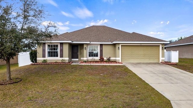 ranch-style house featuring stucco siding, concrete driveway, a front yard, fence, and a garage