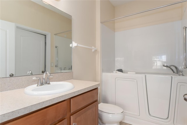 full bathroom featuring vanity and toilet