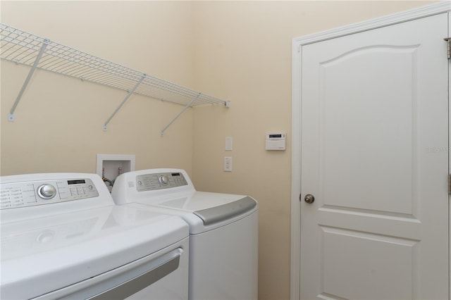 laundry area with laundry area and washer and clothes dryer