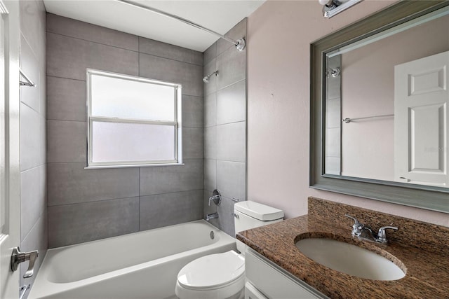 bathroom with  shower combination, vanity, and toilet