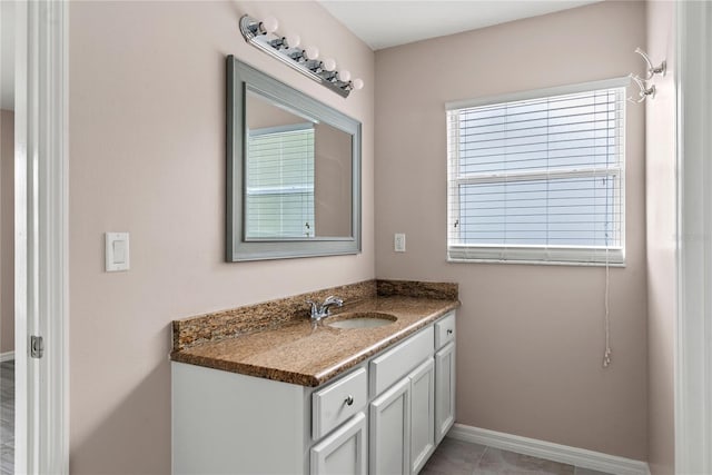 bathroom featuring vanity and baseboards