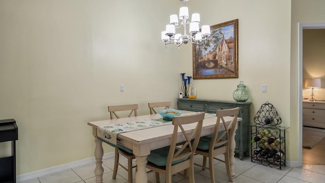 3773 Eversholt St, Clermont, FL 34711 - dining space with a notable chandelier, light tile patterned flooring, and baseboards