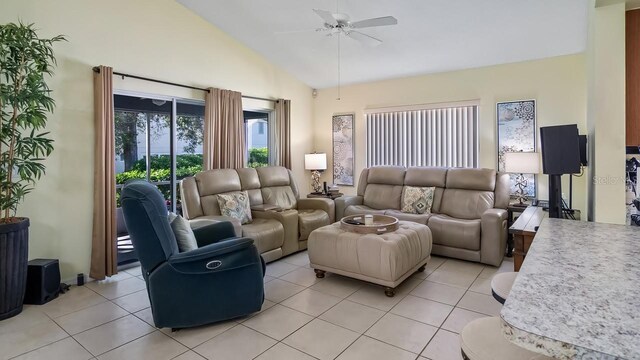 3773 Eversholt St, Clermont, FL 34711 - living area with light tile patterned flooring, a ceiling fan, and vaulted ceiling