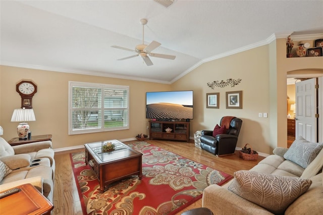 living area with ornamental molding, lofted ceiling, and wood finished floors