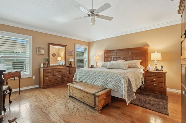 bedroom featuring baseboards, light wood-style floors, and ornamental molding