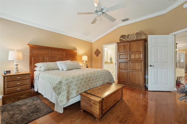 bedroom with visible vents, ornamental molding, a ceiling fan, wood finished floors, and vaulted ceiling