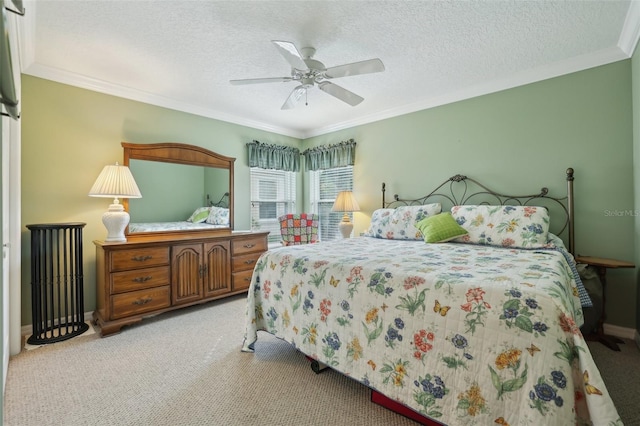 bedroom featuring light carpet, a textured ceiling, ceiling fan, and ornamental molding