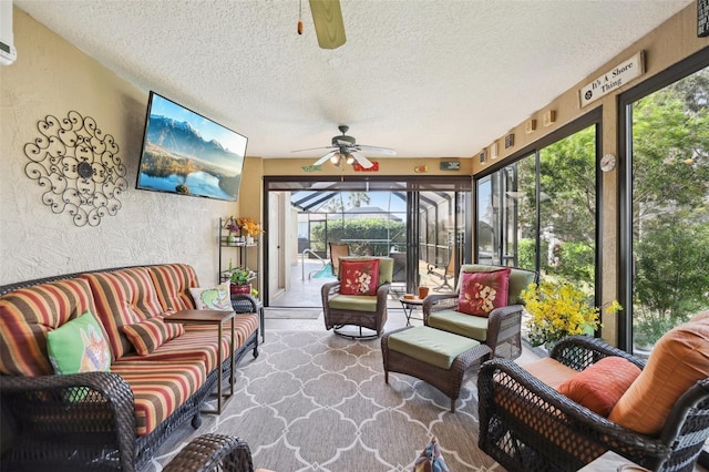 sunroom featuring a ceiling fan